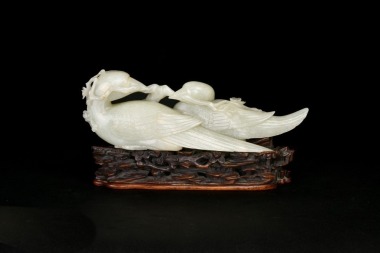 A White Jade Carved Figure of Mandarin Ducks and Prunus with Wood Stand (18th/19th Century)