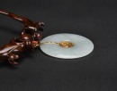 A Jadeite and 14K Gold Dragon and Phoenix Pendant - 4