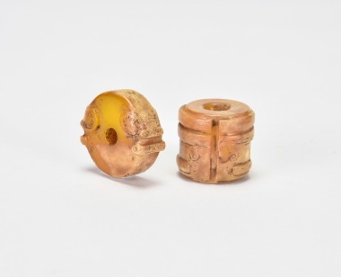 A Group of Two Liangzhu Culture Jade Bead Ornaments Carved with Mask Motifs