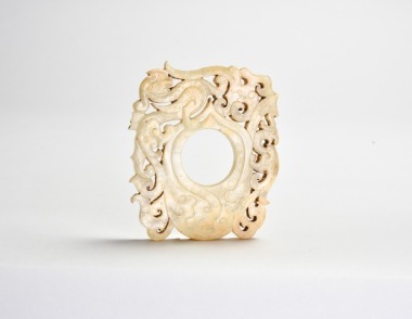 A White Jade &lsquo;Chicken-Heart&rsquo; Pendant With Dragon and Phoenix, Han Dynasty