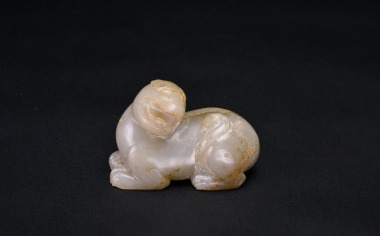 A Celadon Jade Recumbent Mythical Beast, Han Dynasty