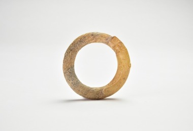 A Chinese Archaic Jade Dragon-Form Ring, Zhou Dynasty