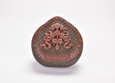 A Carved Polychrome Cinnabar and Black Lacquer Heart-Shaped Covered Box. Qing Dynasty