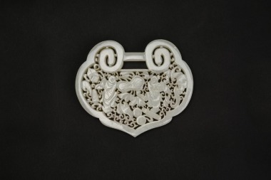 A White Jade Openwork Plaque Depicting the Hehe Erxian and the Hidden Eight Immortals&rsquo; Attributes