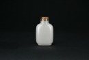 A White Jade Snuff Bottle with Russet Skin. Qing Dynasty