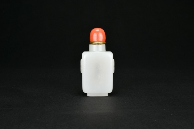 A White Jade &lsquo;Lion Mask&rsquo; Snuff Bottle. Qing Dynasty
