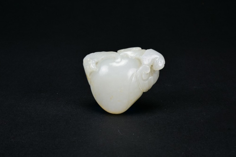 A White Jade &lsquo;Five Bats and Longevity Peach&rsquo; Carving. Qing Qianlong Period.