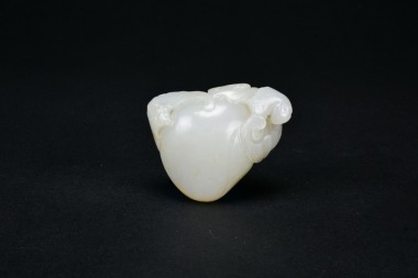A White Jade &lsquo;Five Bats and Longevity Peach&rsquo; Carving. Qing Qianlong Period.