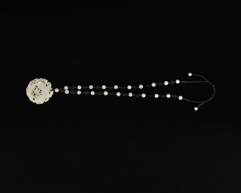 A White Jade Openwork &lsquo;Butterflies and Flowers&rsquo; Pendant Necklace