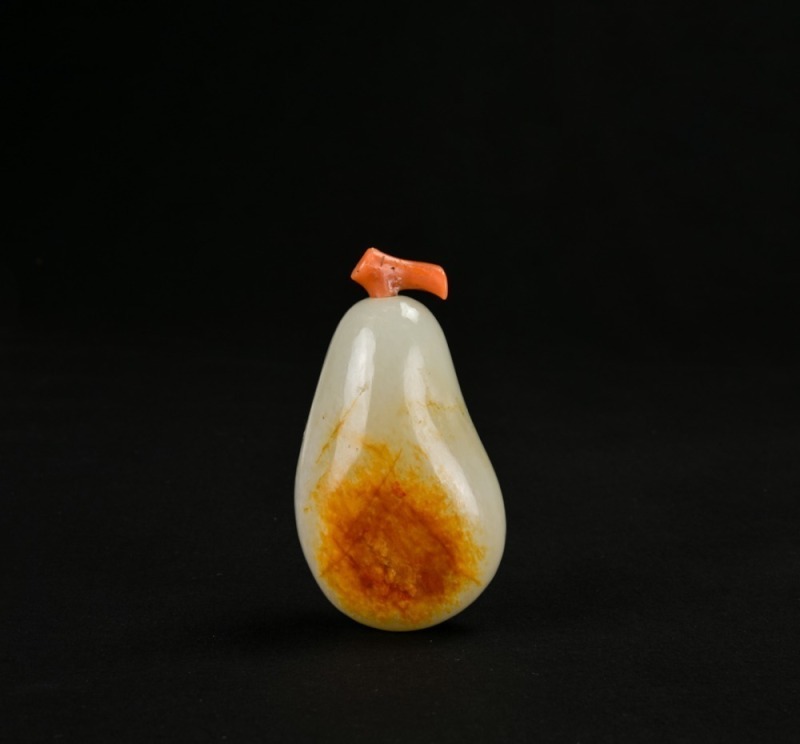 A Late Qing Hetian White Jade Snuff Bottle with Russet Skin