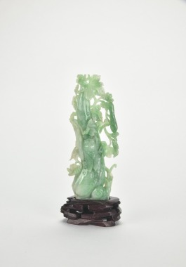 A Carved Jadeite &lsquo;Melons,Cicada and Snail&rsquo; Figure with Wood Stand.