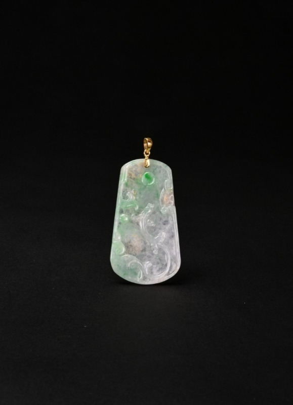 An Icy Jadeite Pendant Carved with a Dragon