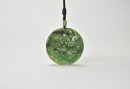 A Jadeite Circular Pendant Carved with Mandarin Ducks