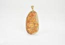 A Carved Jadeite Landscape Pendant with Russet Inclusions