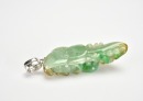 A Carved Jadeite Dragon Pendant with Russet and Emerald Inclusions - 8