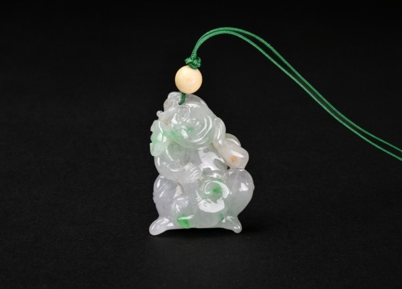 A Carved Jadeite &lsquo;Monkey and Lingzhi&rsquo; Pendant