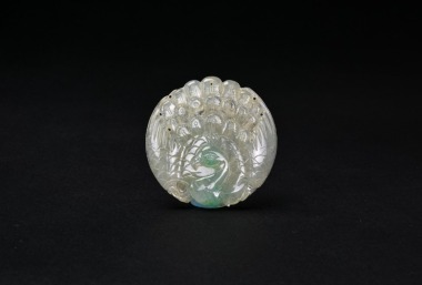 A Carved Icy Jadeite Peacock Pendant