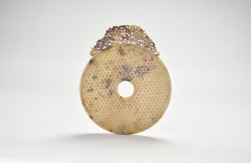 A Large Carved and Pierced Jade Bi with Dragon Decoration, Han Dynasty