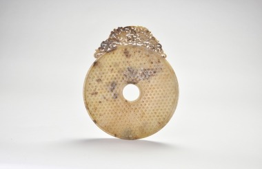 A Large Carved and Pierced Jade Bi with Dragon Decoration, Han Dynasty