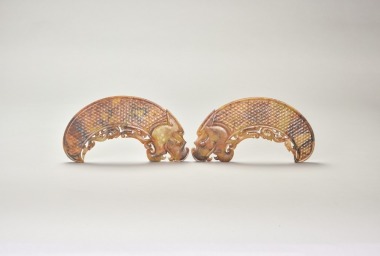 A Pair of Jade Dragon-Form Huang Pendants, Han Dynasty