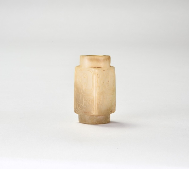 A Pale Celadon and Russet Jade Tubular Bead, Western Zhou Dynasty