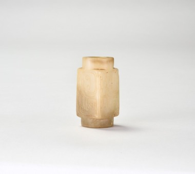 A Pale Celadon and Russet Jade Tubular Bead, Western Zhou Dynasty
