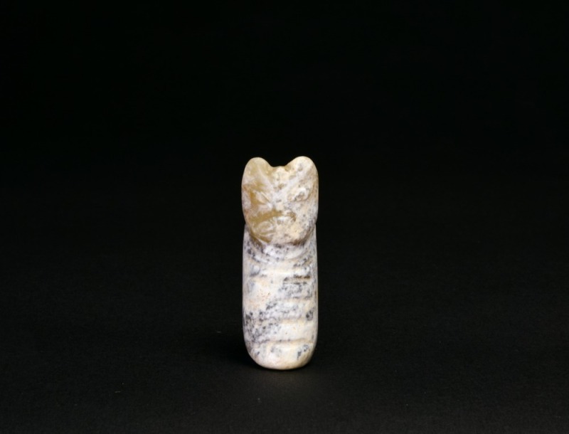 A Mottled Jade Animal-Form Tubular Pendant, Shang Dynasty