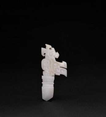 A Carved White Jade Mythical Beast-Form Ceremonial Pendant, Western Zhou Dynasty
