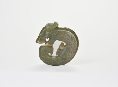 A Carved Jade Coiled-Tail Dragon Pendant, Shang Dynasty