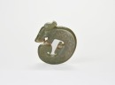 A Carved Jade Coiled-Tail Dragon Pendant, Shang Dynasty