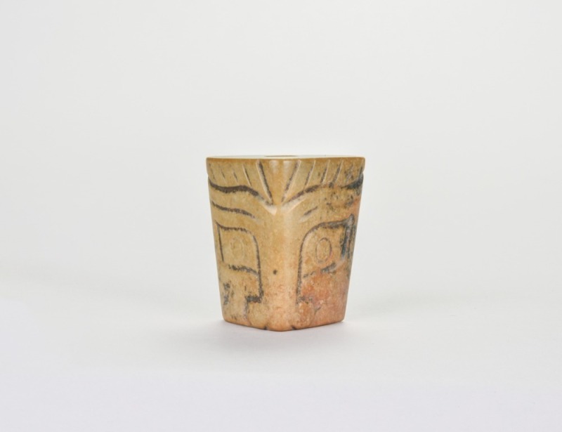 A Carved Triangular Jade Tubular Ornament with Stylized Mask Design, Liangzhu Culture