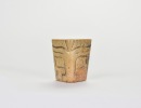 A Carved Triangular Jade Tubular Ornament with Stylized Mask Design, Liangzhu Culture
