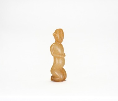 A Carved Jade Figure of a Kneeling Man. Warring States period