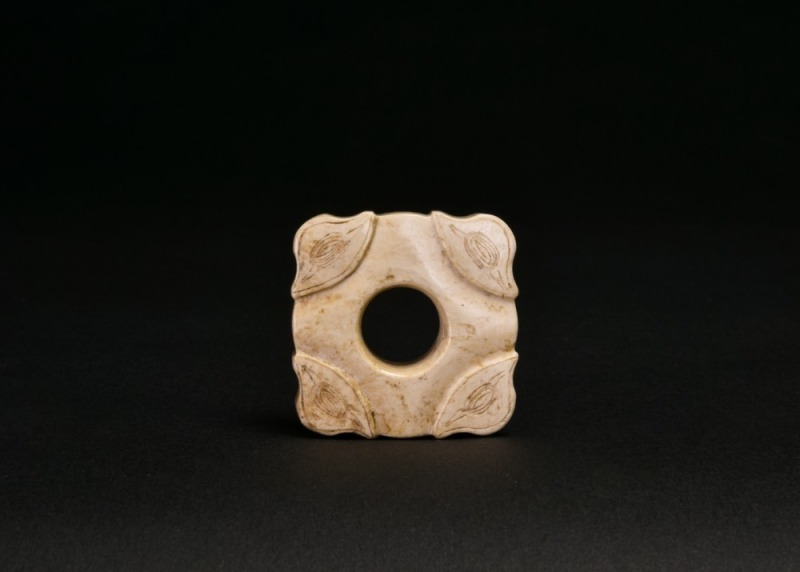 Hongshan Culture. A Carved Jade Square Ornament with Silkworm Motifs