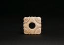 Hongshan Culture. A Carved Jade Square Ornament with Silkworm Motifs