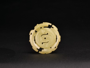 A Pale Yellow Jade Openwork Disc with Dragon and Phoenix Motifs, Warring States Period