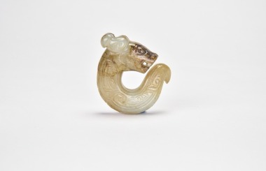 A Carved Jade Coiled Dragon Pendant, Shang Dynasty