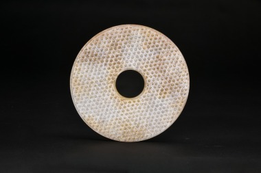 A Carved Jade Grain-Pattern Bi Disc, Han Dynasty