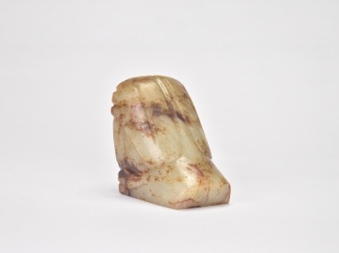 A Celadon and Russet Jade Bird-Form Ornament, Western Zhou Dynasty