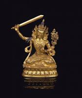 A Gilt-Bronze Figure Of Manjushri