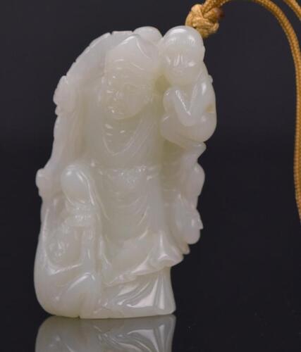 A White Jade Carved ‘Jigong’ And Monkey