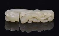 A Celadon White Jade Carved ‘Chi Dragon’ Bell-Buckle’