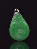 A Jadeite Carved Gold-Coin Pendant