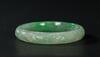 A Semi Translucent Apple Green Jadeite Carved ‘Dragon And Phoenix’ Bangle - 2