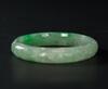 A Semi Translucent Apple Green Jadeite Carved ‘Dragon And Phoenix’ Bangle - 3