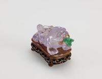 Qing-Amethyst Carved ‘Liu Hai and Toad’ Snuff Bottle, With Wood Stand