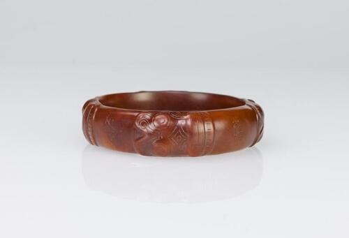 Song- A Reddish Carved Bangle