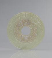 A Jade Disc Engraved &#8216;Zhangle Weiyang
