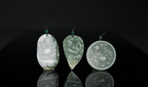 A Group of Three Jadeite Pendants