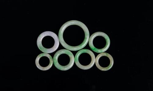 A Group Of Seven Jadeite Circle Pendants